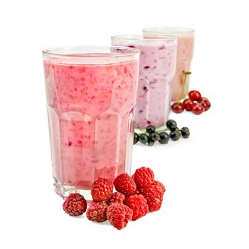 Milkshakes with black currant, cherry, raspberry in glass jars isolated on white background