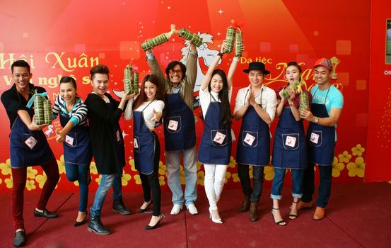 HO CHI MINH CITY, VIET NAM- JAN 15: Artist people in make cake competition, they doing traditional food - banh tet: famous food in Tet (Lunar New Year)- with  joyful and clever, Vietnam, Jan 15, 2013