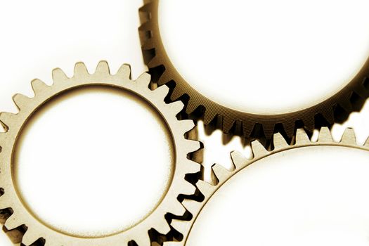 Closeup of three metal cog gears