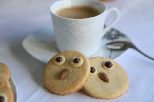 Two owl biscuits and a cup of coffee for a nice break