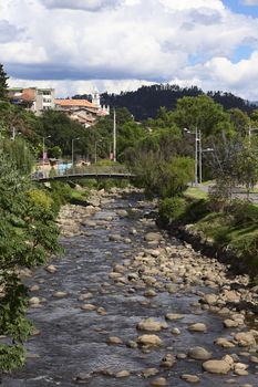 CUENCA, ECUADOR - FEBRUARY 13, 2014: View of the River Tomebamba from the bridge Puente del Centenario on February 13, 2014 in Cuenca, Ecuador