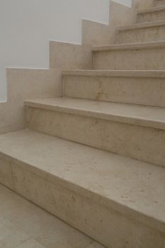 Indoor stairs done from Tunisian polished beige marble called New Imperial Marble