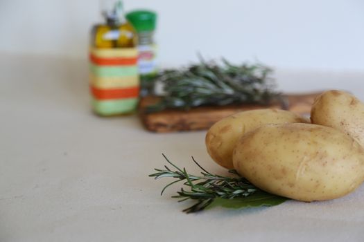 ingridients for baked potatoes with rosemary and bay leaf
