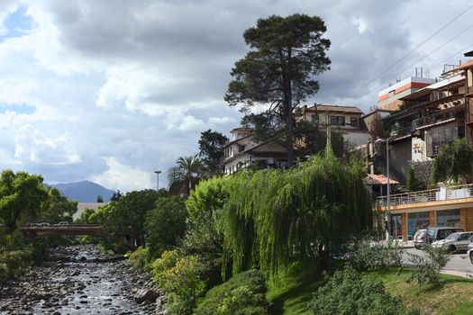 CUENCA, ECUADOR - FEBRUARY 13, 2014: View onto the River Tomebamba and the bridge Puente del Centenario on February 13, 2014 in Cuenca, Ecuador