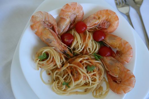 Spaghetti prepared with sicilian salsa, cherry tomatoes, norwegian lobsters, garlic,basil,and parsley