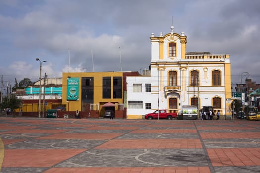 RIOBAMBA, ECUADOR - FEBRUARY 16, 2014: The square behind the train station of Riobamba, with view onto the buildings of the Calle Juan Lavalle on February 16, 2014 in Riobamba, Ecuador 