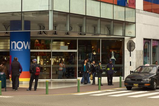 LIMA, PERU - SEPTEMBER 25, 2011: Unidentified people at the entrance of the Ripley department store on September 25, 2011 on the corner of Pje. Los Pinos and Calle Schell in the district of Miraflores, Lima, Peru 