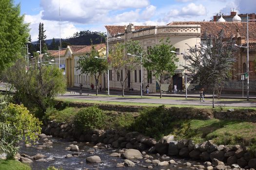 CUENCA, ECUADOR - FEBRUARY 13, 2014: View onto the river Tomebamba and the Avenida 12 de Abril on February 13, 2014 in Cuenca, Ecuador