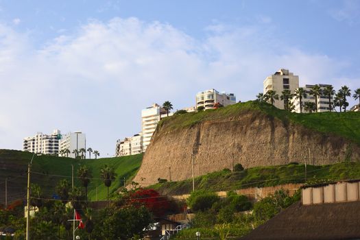 LIMA, PERU - APRIL 2, 2012: View onto the cliff line, the Parque del Amor (Park of Love) and the Malecon Cisneros from below, the Circuito de Playas on April 2, 2012 in Miraflores, Lima, Peru  