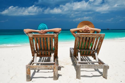 Couple in green on a tropical beach at Maldives