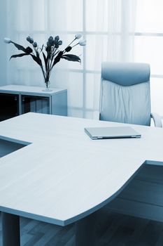 laptop on a table of director at modern office