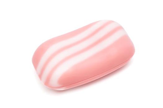 a piece of pink soap on a white background