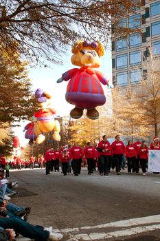 Atlanta, GA, USA - December 1, 2012:  Large inflated balloon characters and volunteers move through the parde route at the annual Atlanta Christmas parade in downtown Atlanta.