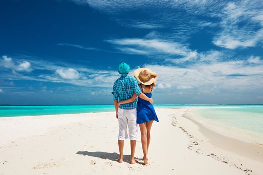 Couple in blue on a tropical beach at Maldives