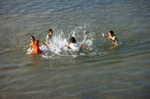 KHANH HOA, VIET NAM- FEBRUARY 5: Chidren playing, bathe in the river, this is warning about  children's drowning  situation at countryside, Khanh Hoa, February 5, 2013