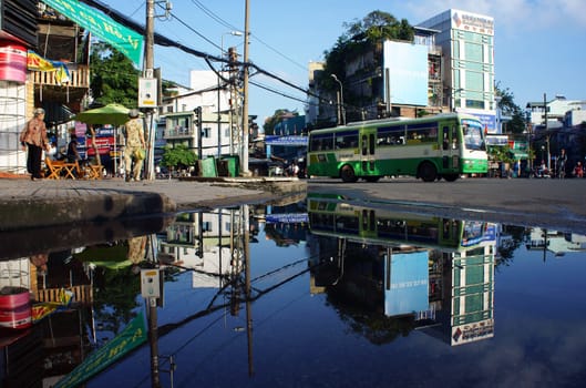 HO CHI MINH, VIET NAM- OCTOBER 20: Cityscape reflect on water in morning, Sai Gon, VietNam, October 20, 2013