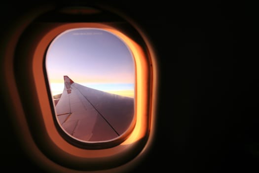 Window airplane Travel time is sunset.