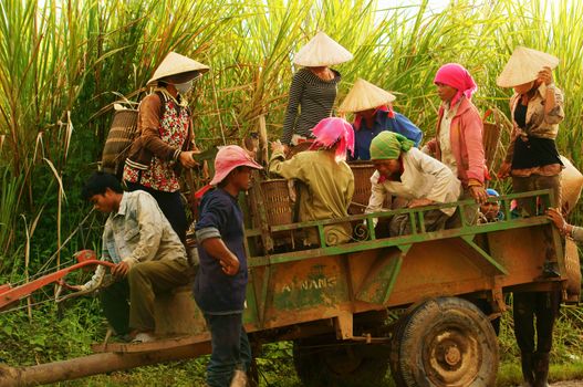 DAK LAK, VIET NAM- SEPTEMBER 4: Lifestyle of countryside people, they ready to move by farm tractor in Daklak, VietNam, September 4, 2012