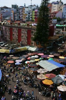 DA LAT, VIET NAM- FEB 8: Crowded, busy scene 's market with crowd of people go to markets to buy goods repair for Tet (Lunar New Year) in Da Lat, Viet Nam on February 8, 2013