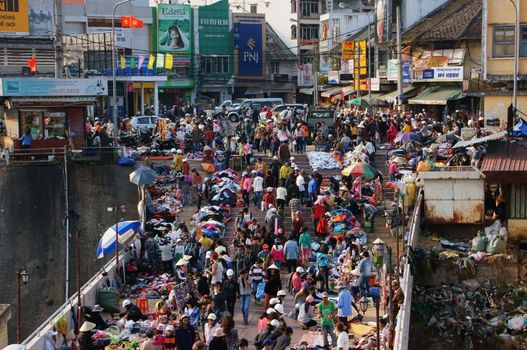 DA LAT, VIET NAM- FEB 8: Crowded, colorful scene 's market with crowd of people go to markets to buy goods repair for Tet in Da Lat, VietNam on February 8, 2013