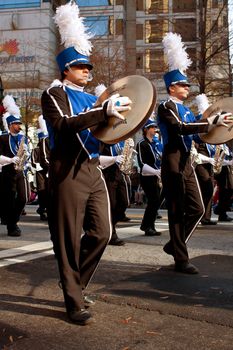Atlanta, GA, USA - December 1, 2012:   Cymbal players from the Georgia State University band march in the annual Atlanta Christmas parade in downtown Atlanta.