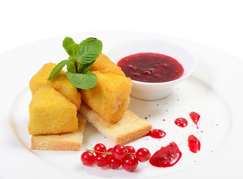 The cheese in breadcrumbs with currant jam