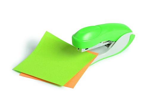 The green stapler isolated on white background