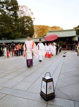 TOKYO,JAPAN-NOV 20 :A Japanese wedding ceremony at Shrine on November 20,2013.As Meiji Jingu Shrine is an active shrine it's possible to see wedding parties parading through the inner ground of the shrine 