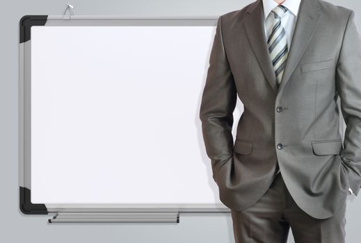 Man in suit and office board. Gray background