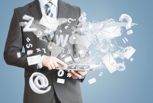 Man in suit holding tablet pc. Envelopes and letters are emitted from the screen tablet. The concept of mailing