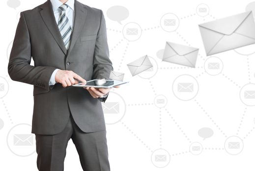 Man in suit holding tablet pc. Envelopes are emitted from the screen tablet. The concept of mailing