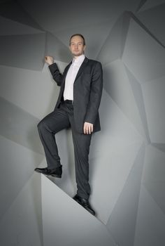  man in a suit and tie on the geometric background