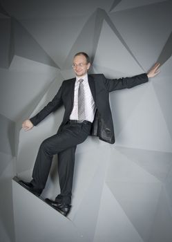  man in a suit and tie on the geometric background