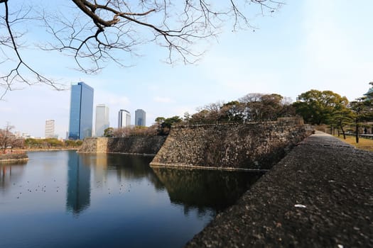 A moat surrounding Osaka castle in Japan, winter