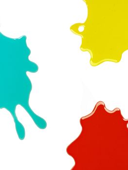 three colored stains on white background