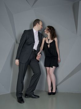 man and woman in love on a grey background