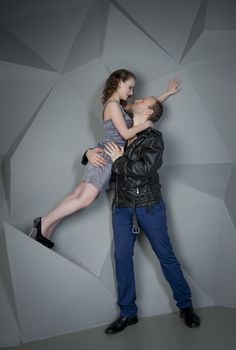 man and woman in love on a grey background