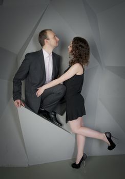 man and woman in love on a grey background