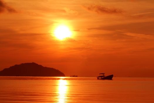 Abandoned fishing boat voer sunset, Phuket south of Thailand