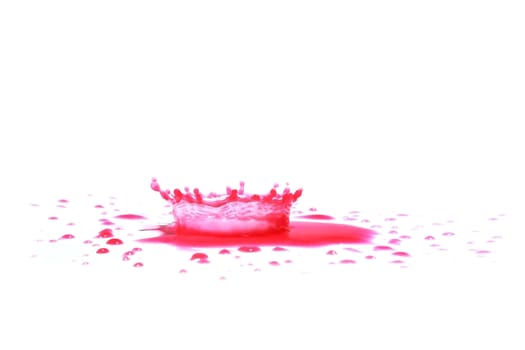 Red paint splashing isolated on white