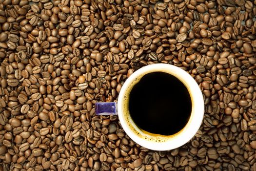 Black coffee on coffee beans background