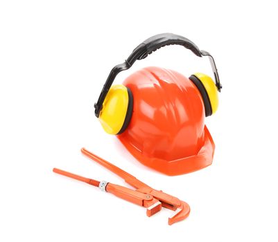 Protective helmet with headphones and wrench key. Isolated on a white background.