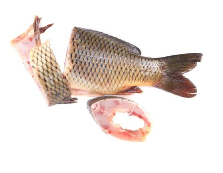 Fillet and tail of fresh raw fish carp. Isolated on a white background.