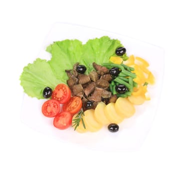 Salad with beef fillet and potatoes. Isolated on a white background.