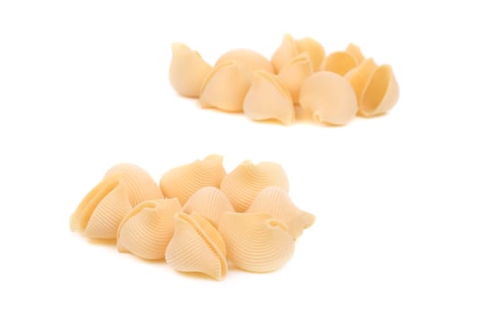 Uncooked pasta lumaconi. Isolated on a white background.