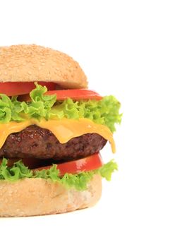 Appetizing cheeseburger. Isolated on a white background.