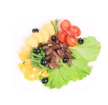 Salad with beef fillet and potatoes. Isolated on a white background.