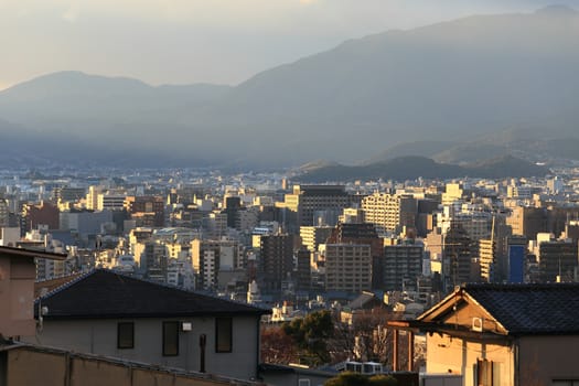 Kyoto, Japan - city in the region of Kansai. Aerial view with skyscrapers. Sunset light.