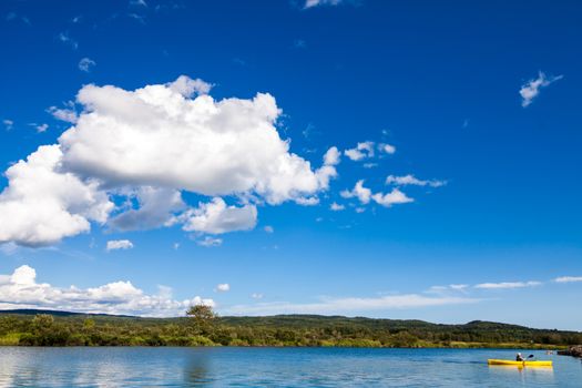 Calm River and Woman Kayaking in Gaspe, Quebec, Canada