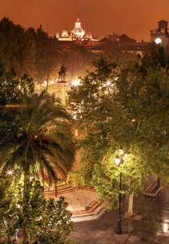 Plaza Nueva Ferdinand Statue Rainy Night Church El Salvador Seville Andalusia Spain.